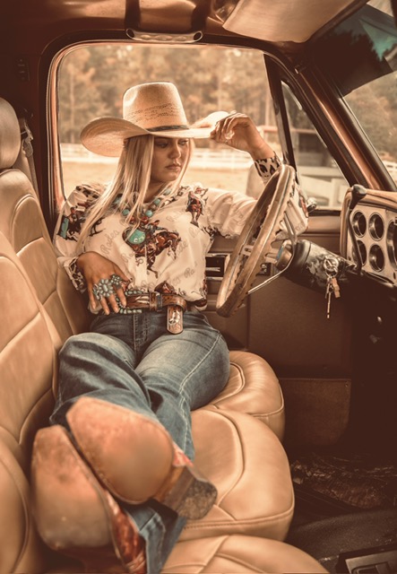 Cowgirl in vintage truck
